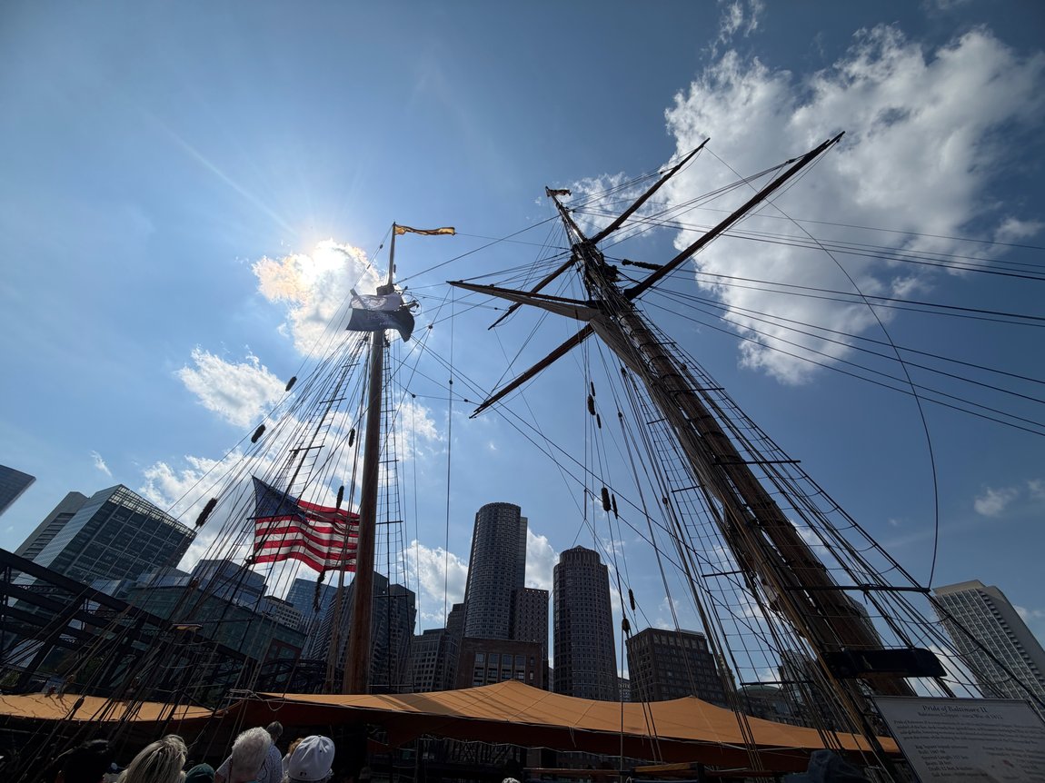 Tall ship rigging against the Boston skyline at Sail Boston